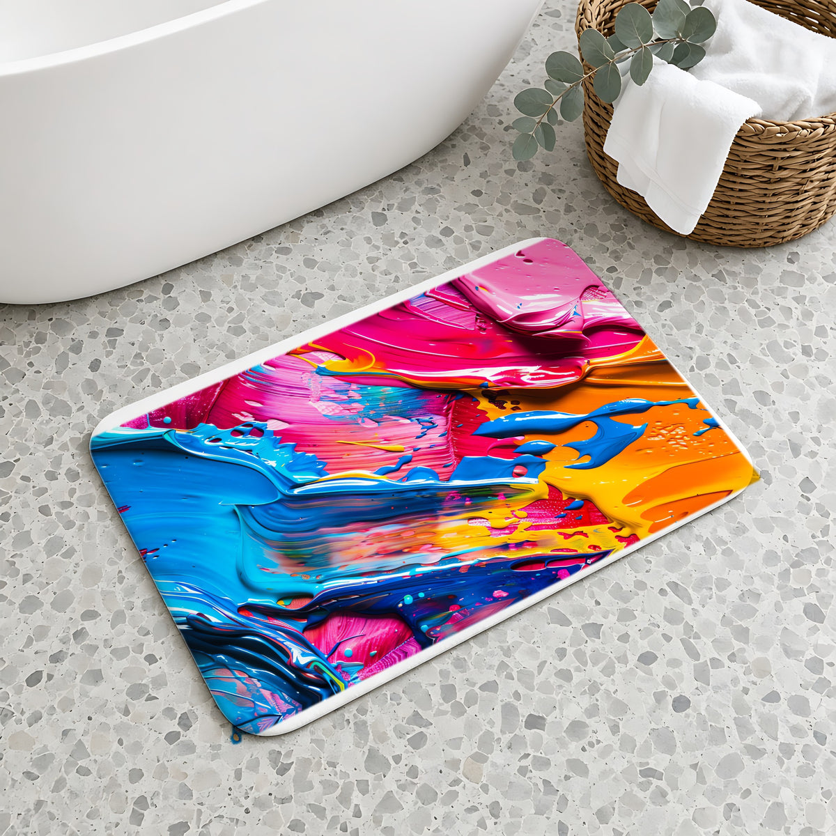Rainbow Paint Smear Bath Mat on a terrazzo floor beside a freestanding bath