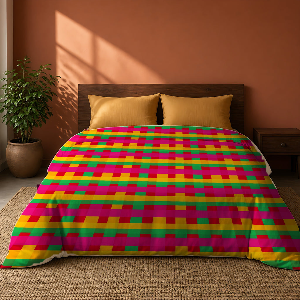 Grand Jewel Plaid Comforter on a king bed against a warm terracotta wall