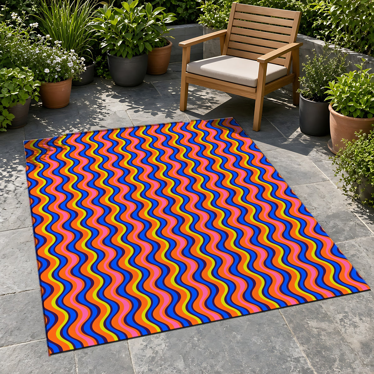 Warped Circus Stripes Outdoor Rug on a stone patio with potted plants
