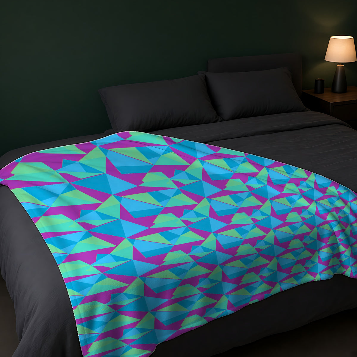 Faceted Panels Sherpa Fleece Blanket across the foot of a dark bed