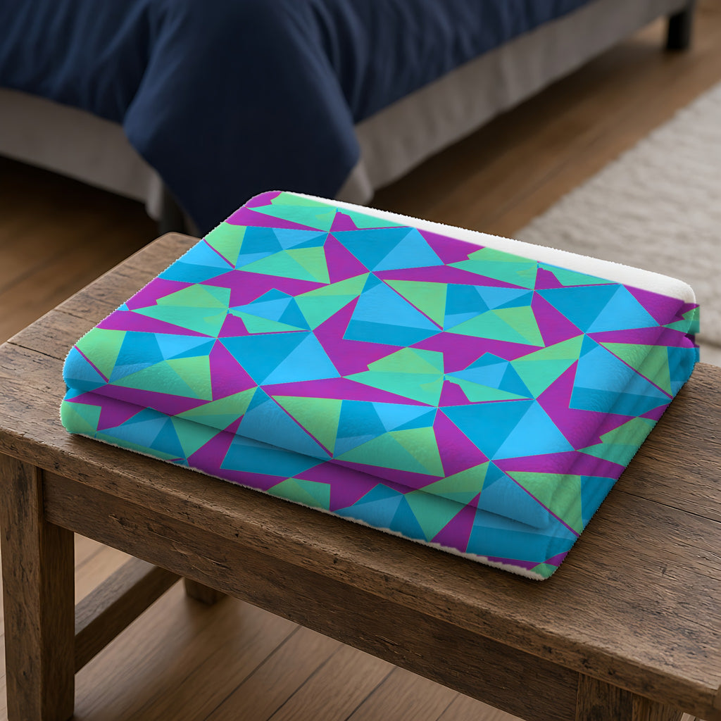 Faceted Panels Sherpa Fleece Blanket folded on a wooden bench