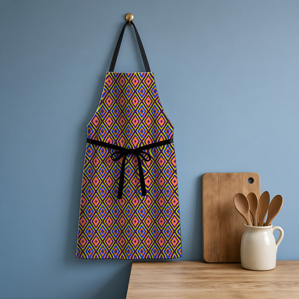 Diamond Ripples Apron hanging in a blue kitchen