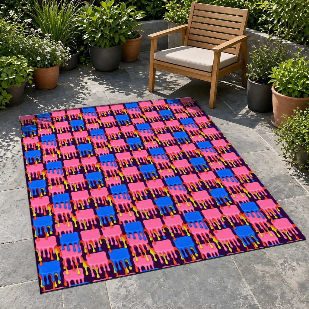 Melting Checkerboard Outdoor Rug on a stone patio with potted plants