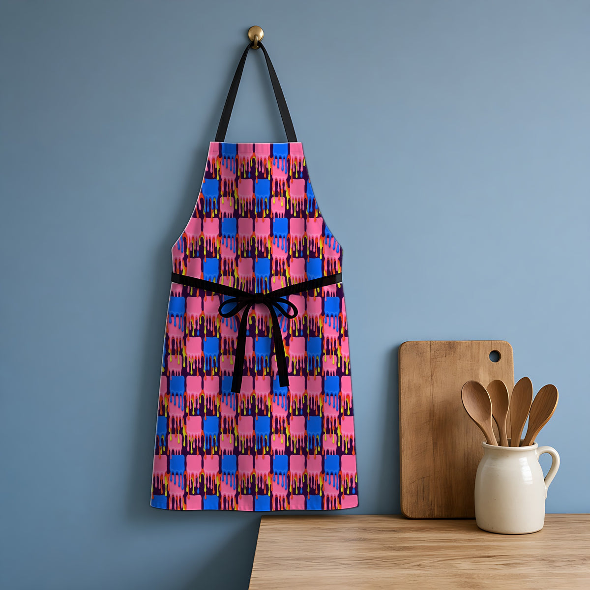 Melting Checkerboard Apron hanging in a blue kitchen