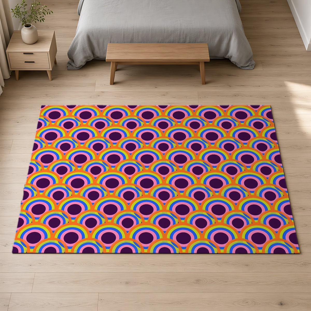 Pop Op Circles Outdoor Rug on a pale oak floor in a calm bedroom