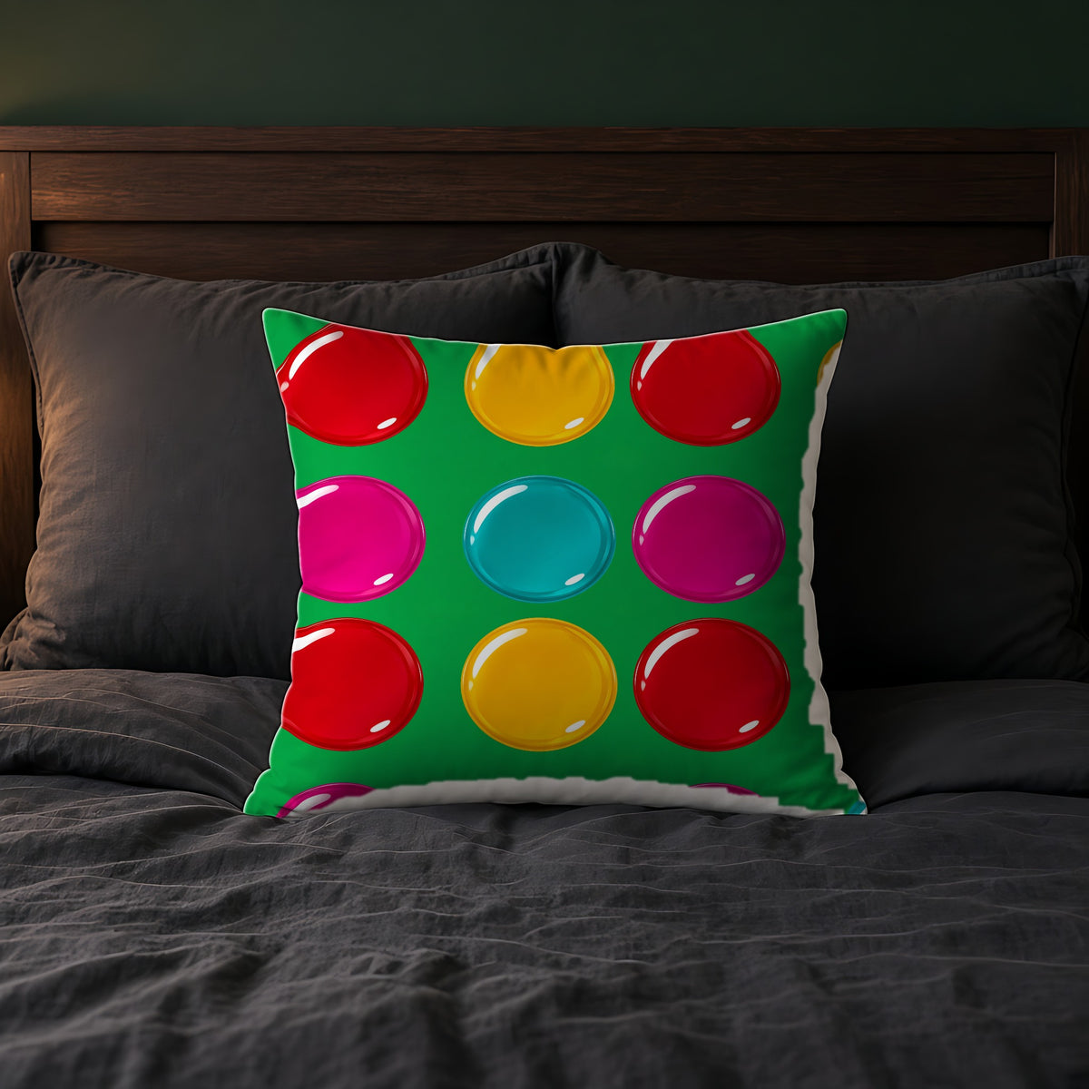 Giant Candy Glass Discs Faux Suede Cushion on a bed with charcoal bedding