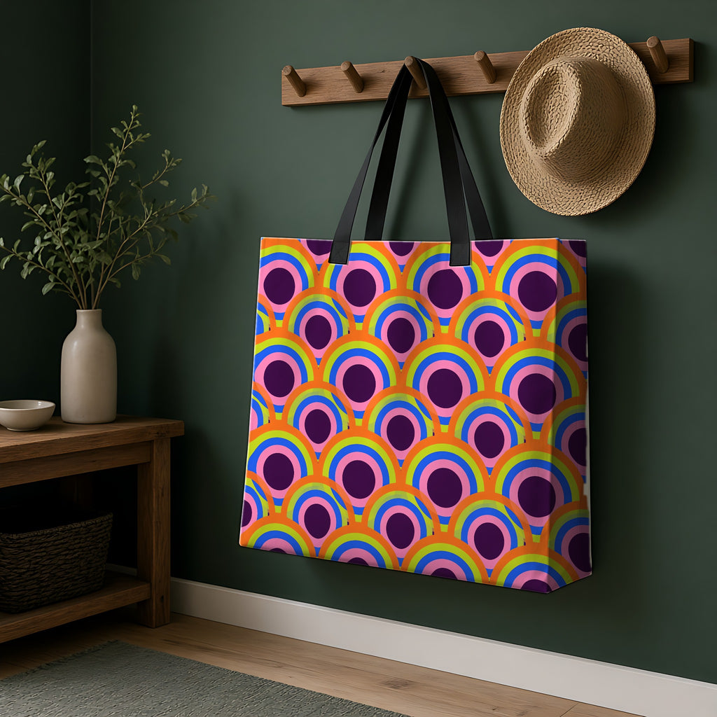 Pop Op Circles Weekender Tote Bag hanging on a peg rail in a green hallway
