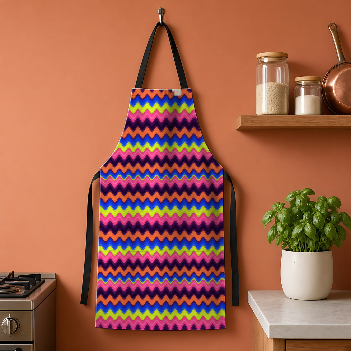 Bold Wave Stripes Apron hanging on a terracotta kitchen wall