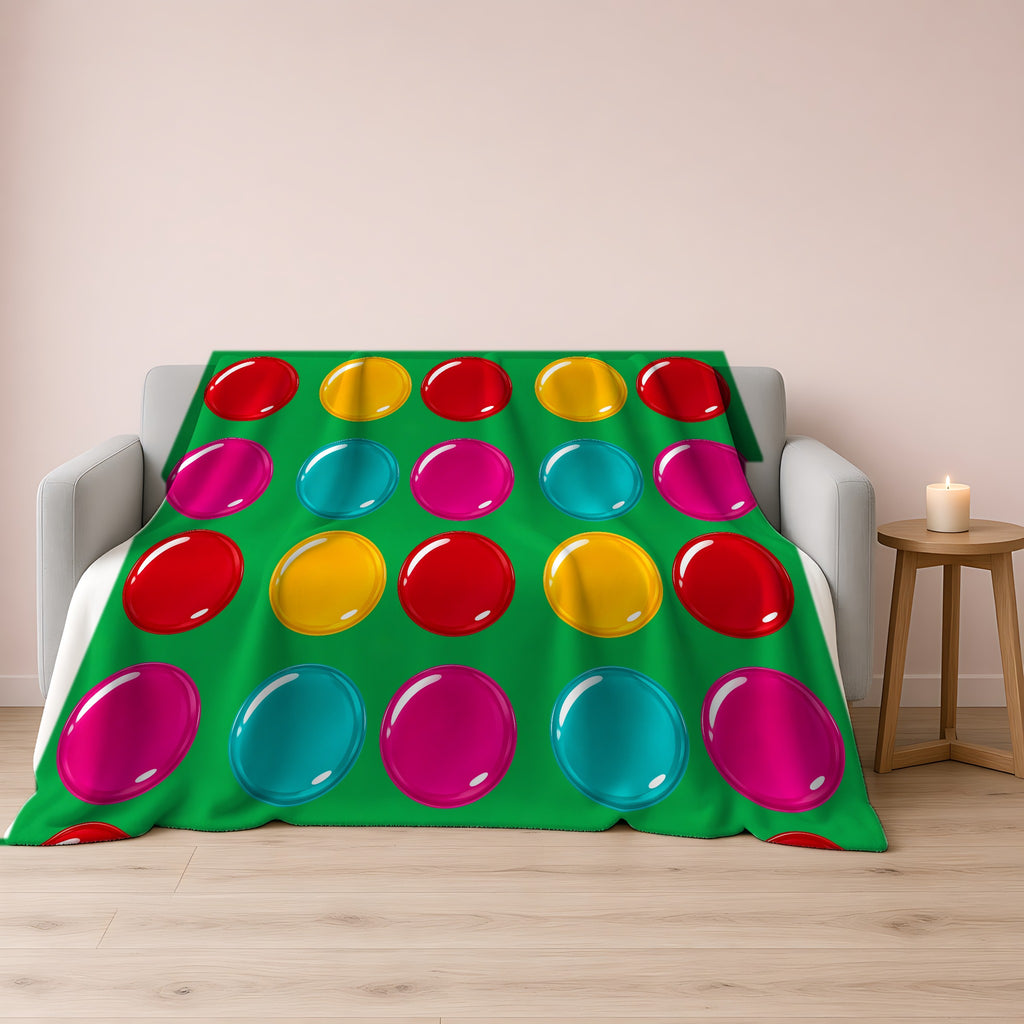 Giant Candy Glass Discs Sherpa Fleece Blanket draped over a grey sofa