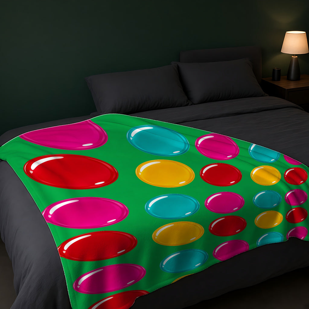 Giant Candy Glass Discs Sherpa Fleece Blanket across the foot of a dark bed
