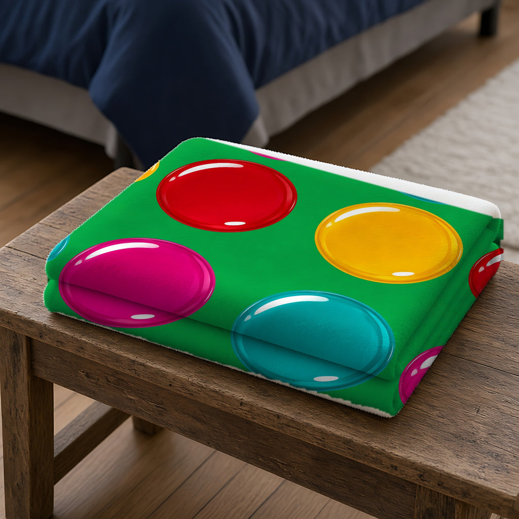 Giant Candy Glass Discs Sherpa Fleece Blanket folded on a wooden bench