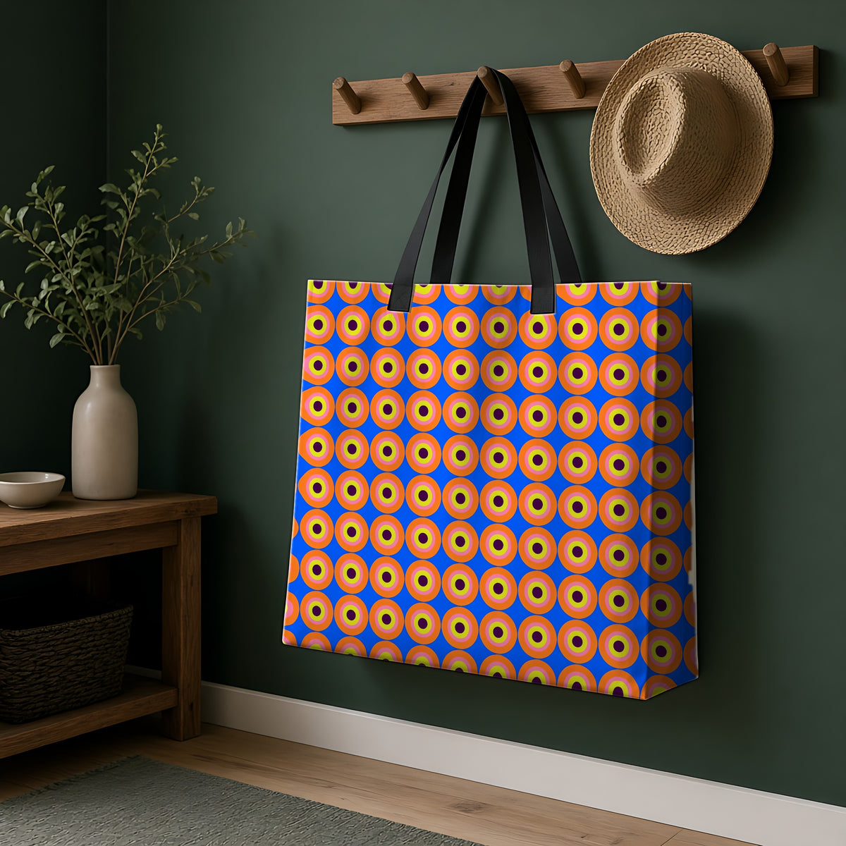 Pop Target Dots Weekender Tote Bag hanging on a peg rail in a green hallway