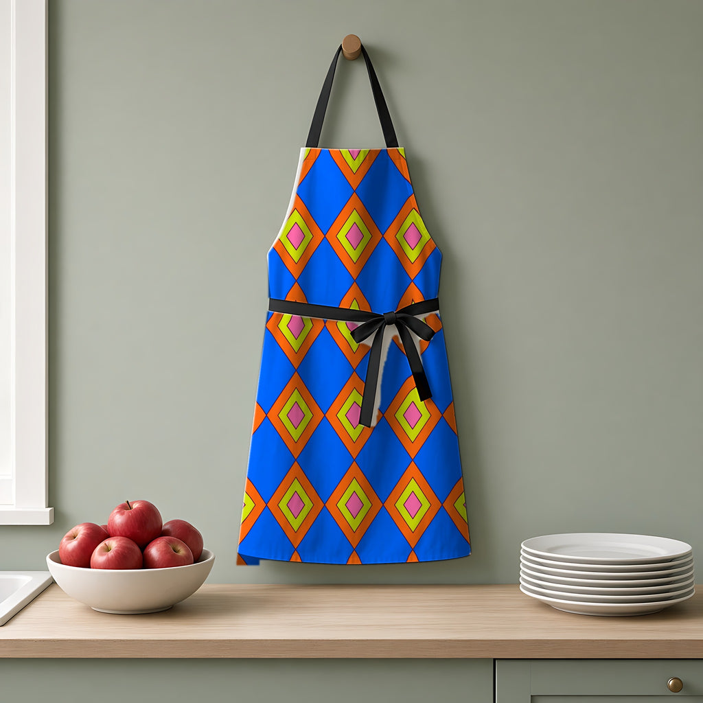 Pop Diamond Checks Apron hanging on a sage-green kitchen wall