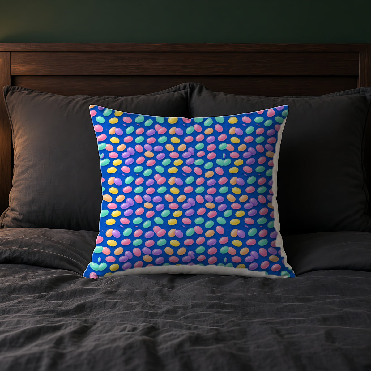 Jelly Bean Scatter Faux Suede Cushion on a bed with charcoal bedding