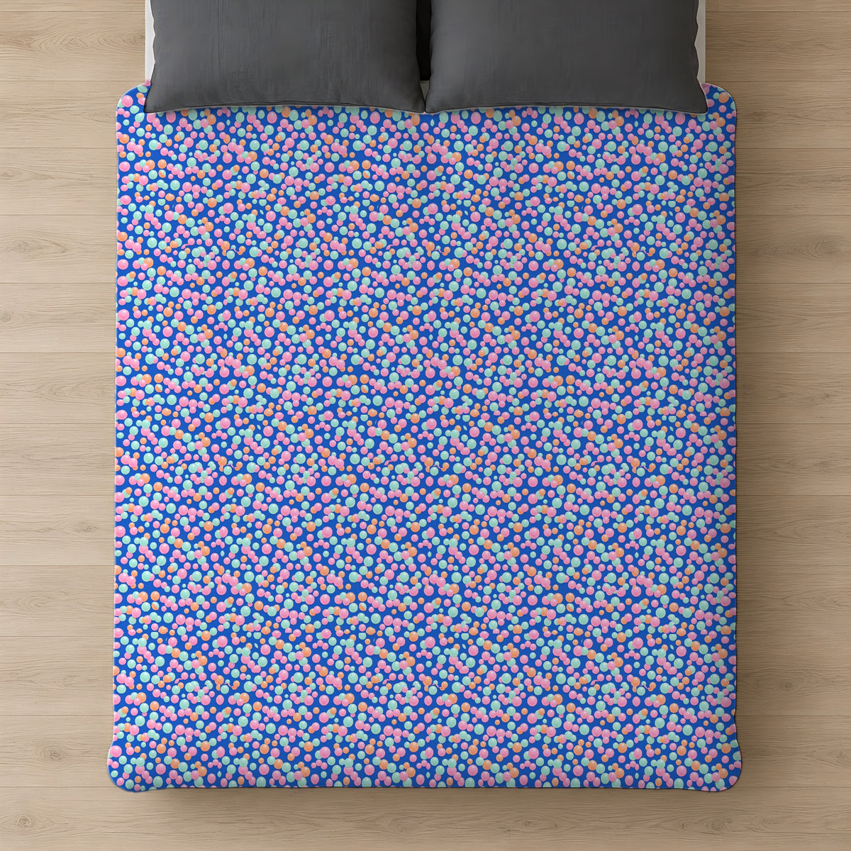 Bubble Cluster Pop Cotton Duvet Cover on a bed, seen from above