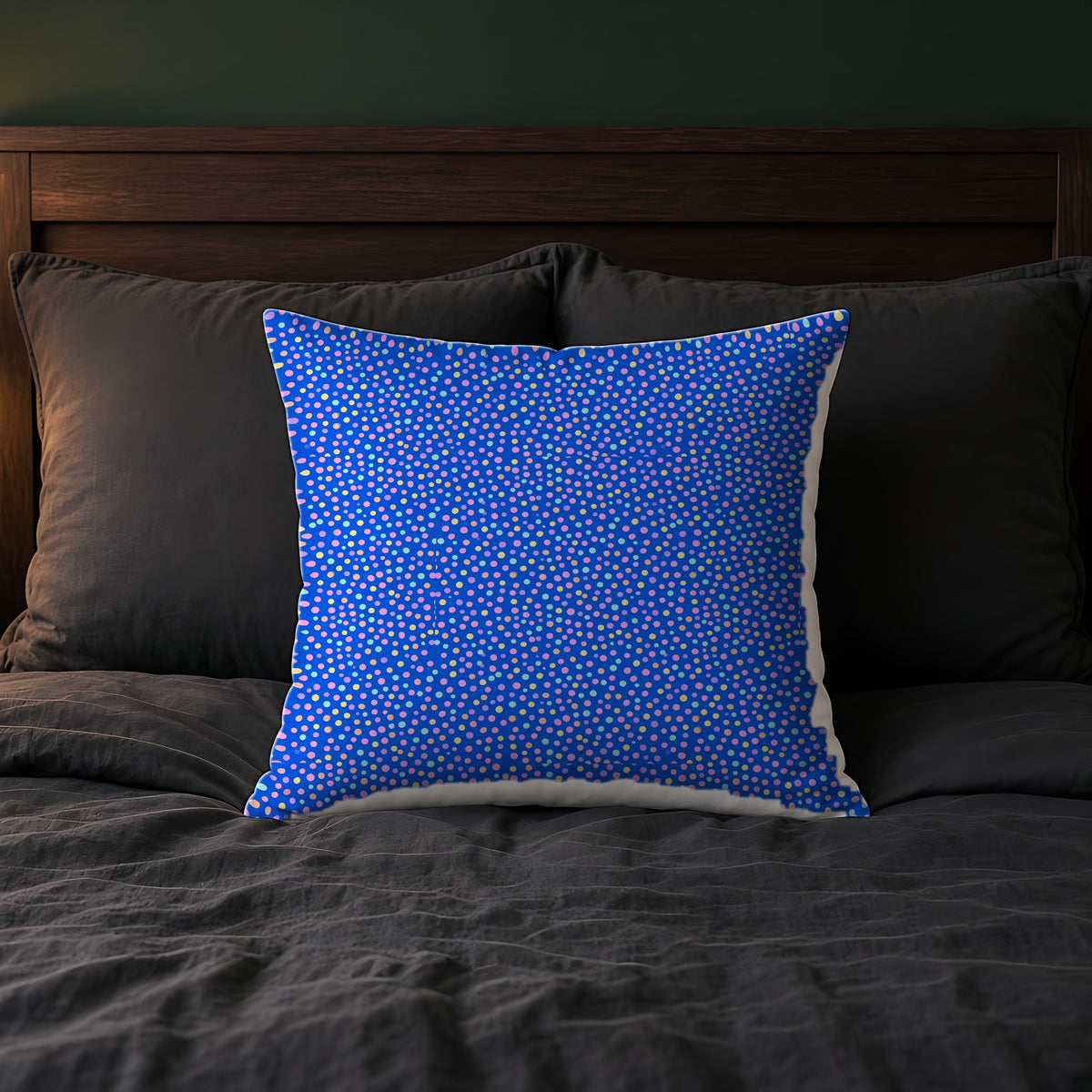 Sugar Confetti Faux Suede Cushion on a bed with charcoal bedding