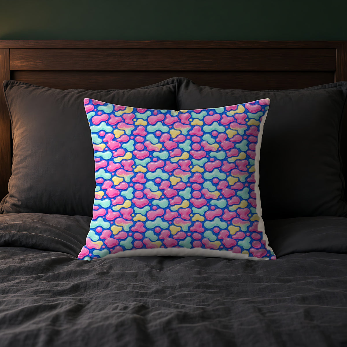 Pastel Lava Blobs Faux Suede Cushion on a bed with charcoal bedding