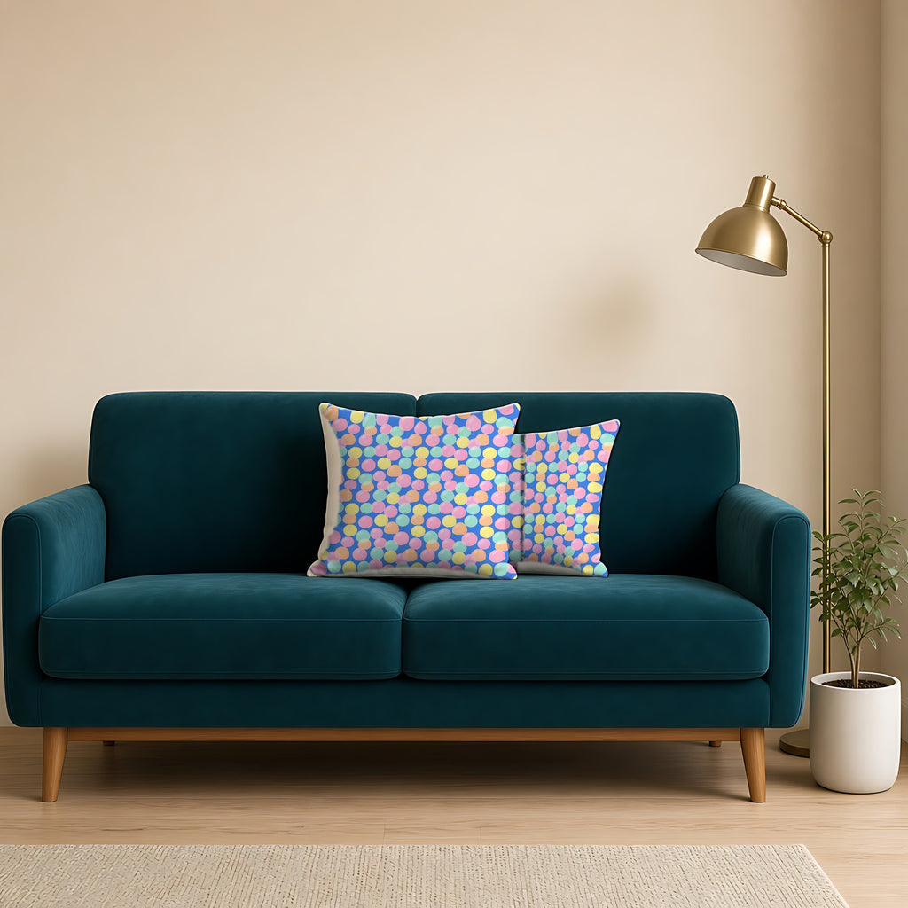Gumdrop Orbs Faux Suede Cushion on a teal velvet sofa