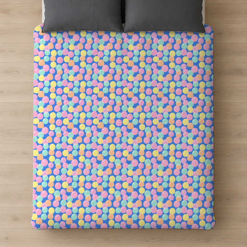 Gumdrop Orbs Cotton Duvet Cover on a bed, seen from above
