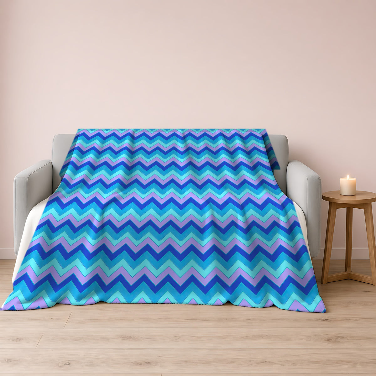 Jewel Chevron Bands Sherpa Fleece Blanket draped over a grey sofa