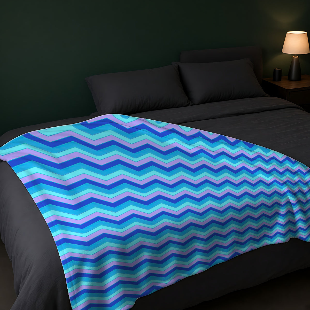 Jewel Chevron Bands Sherpa Fleece Blanket across the foot of a dark bed