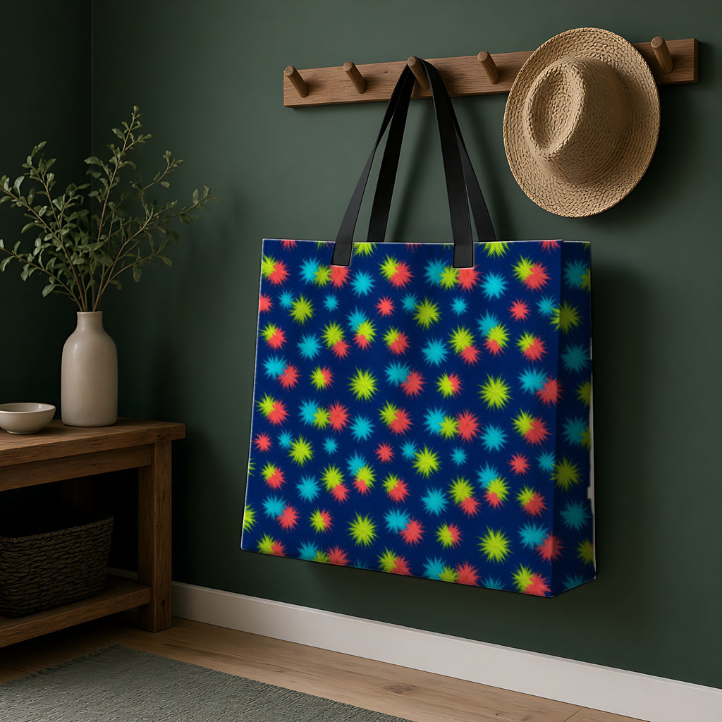 Dye Drop Spread Weekender Tote Bag hanging on a peg rail in a green hallway