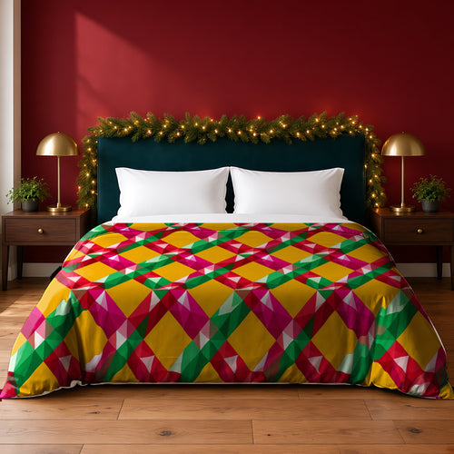 Big Jewel Prism Weave II cotton duvet cover in the Christmas Jewel Bright palette, on a bed with a green headboard in a festive bedroom with pine garland and fairy lights