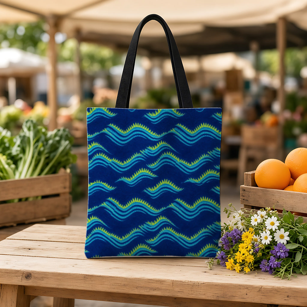 Pleat Wave Dye Weekender Tote Bag on a wooden bench at a farmers market