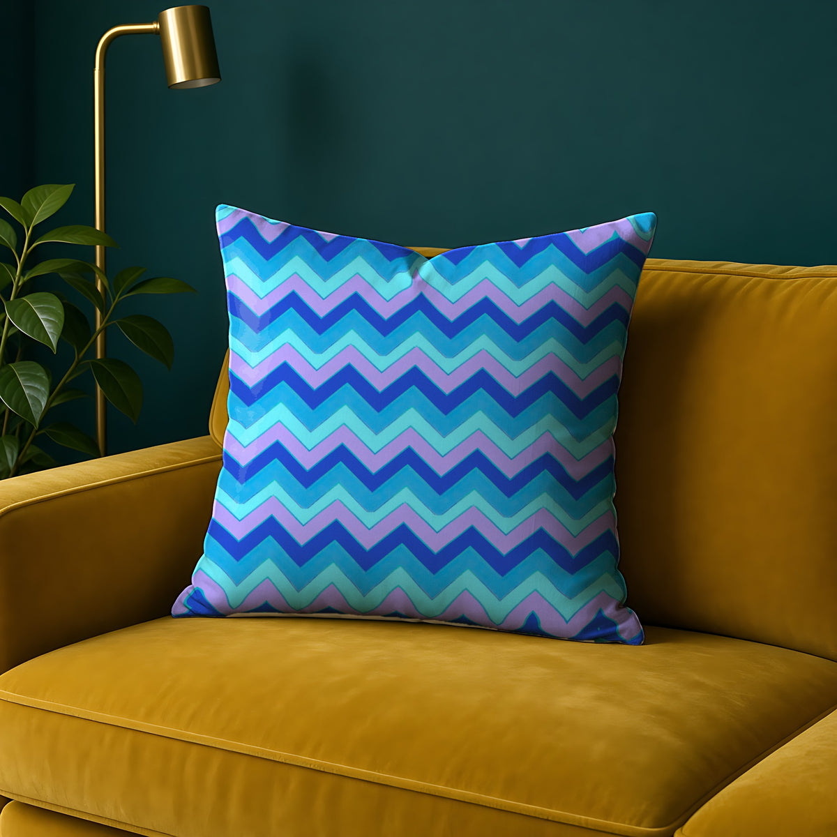 Jewel Chevron Bands Faux Suede Cushion in the Ice Jewel palette, on a mustard sofa against a teal wall