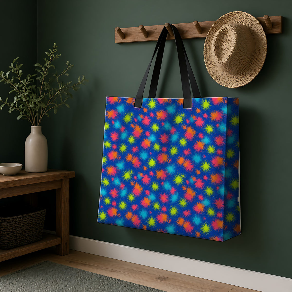 Speckle Bleed Weekender Tote Bag hanging on a peg rail in a green hallway