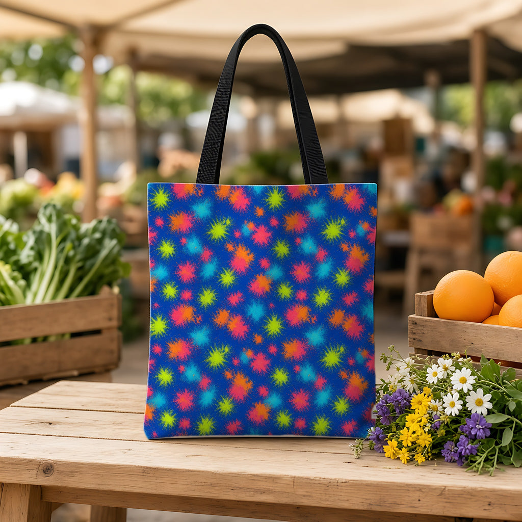 Speckle Bleed Weekender Tote Bag on a wooden bench at a farmers market
