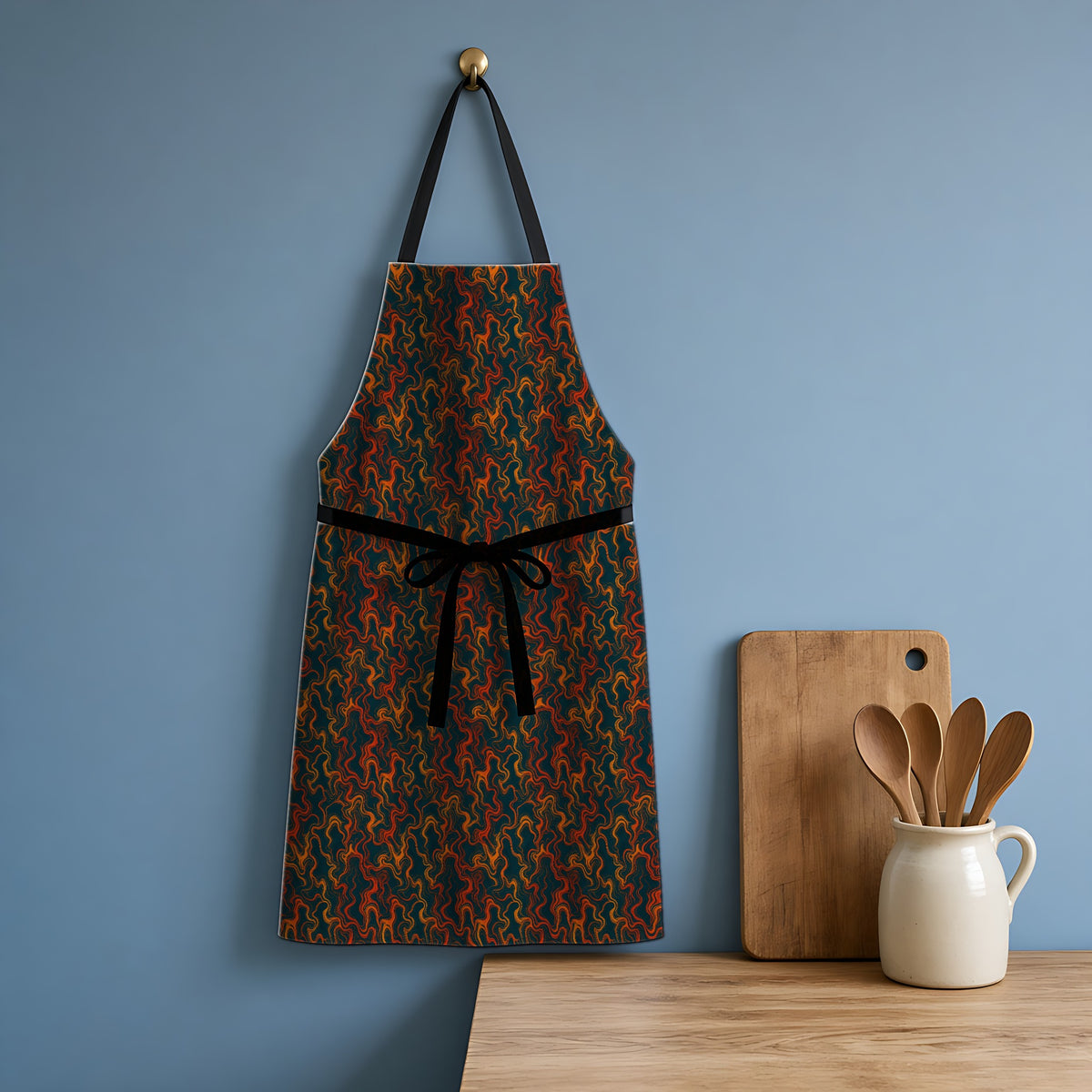 Drifting Ripples Apron hanging in a blue kitchen