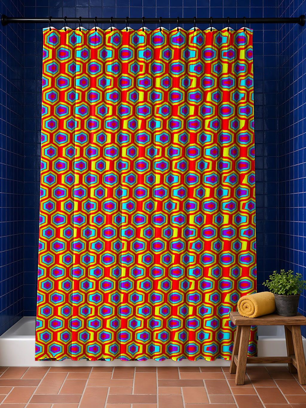 Concentric Hexagon Ripple shower curtain in the Chromatic Ripple palette, hanging in a bathroom with cobalt tiles and a terracotta floor