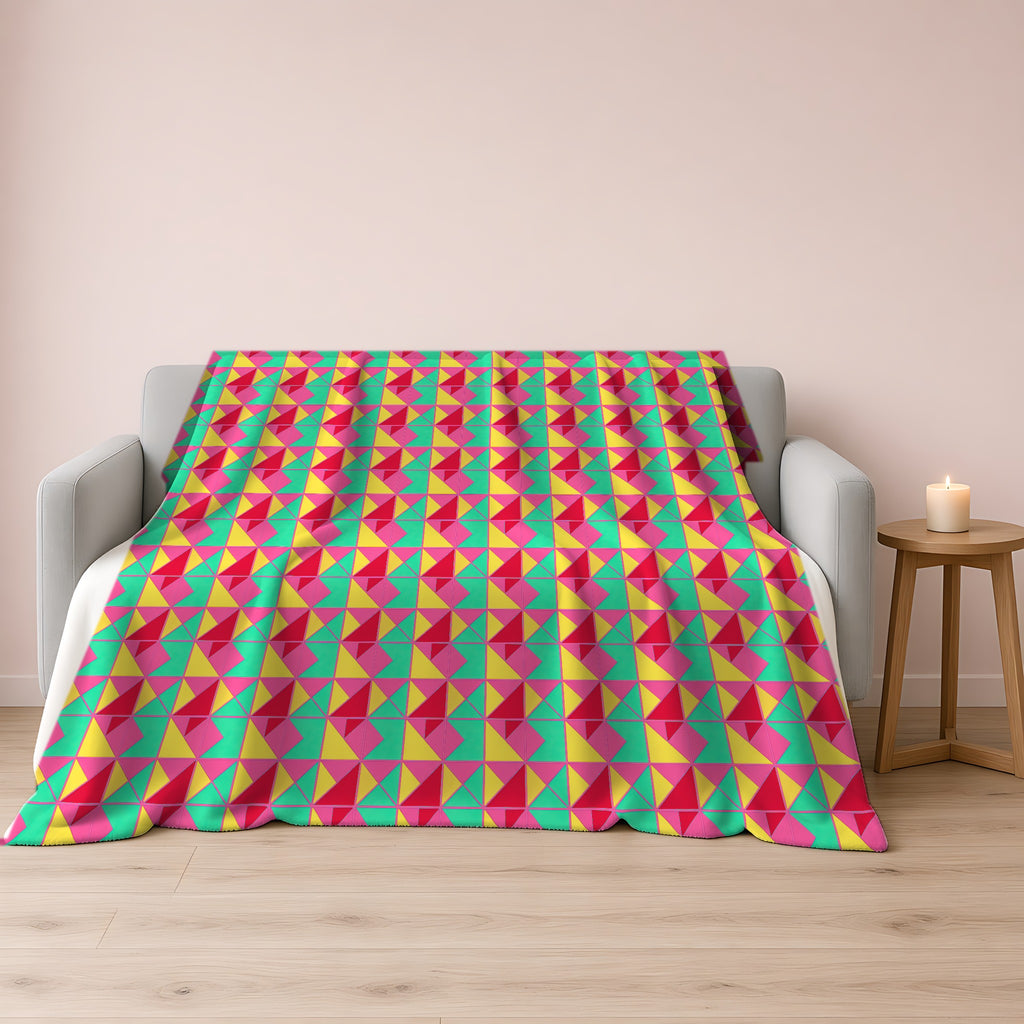 Jewel Block Quilt Sherpa Fleece Blanket draped over a grey sofa