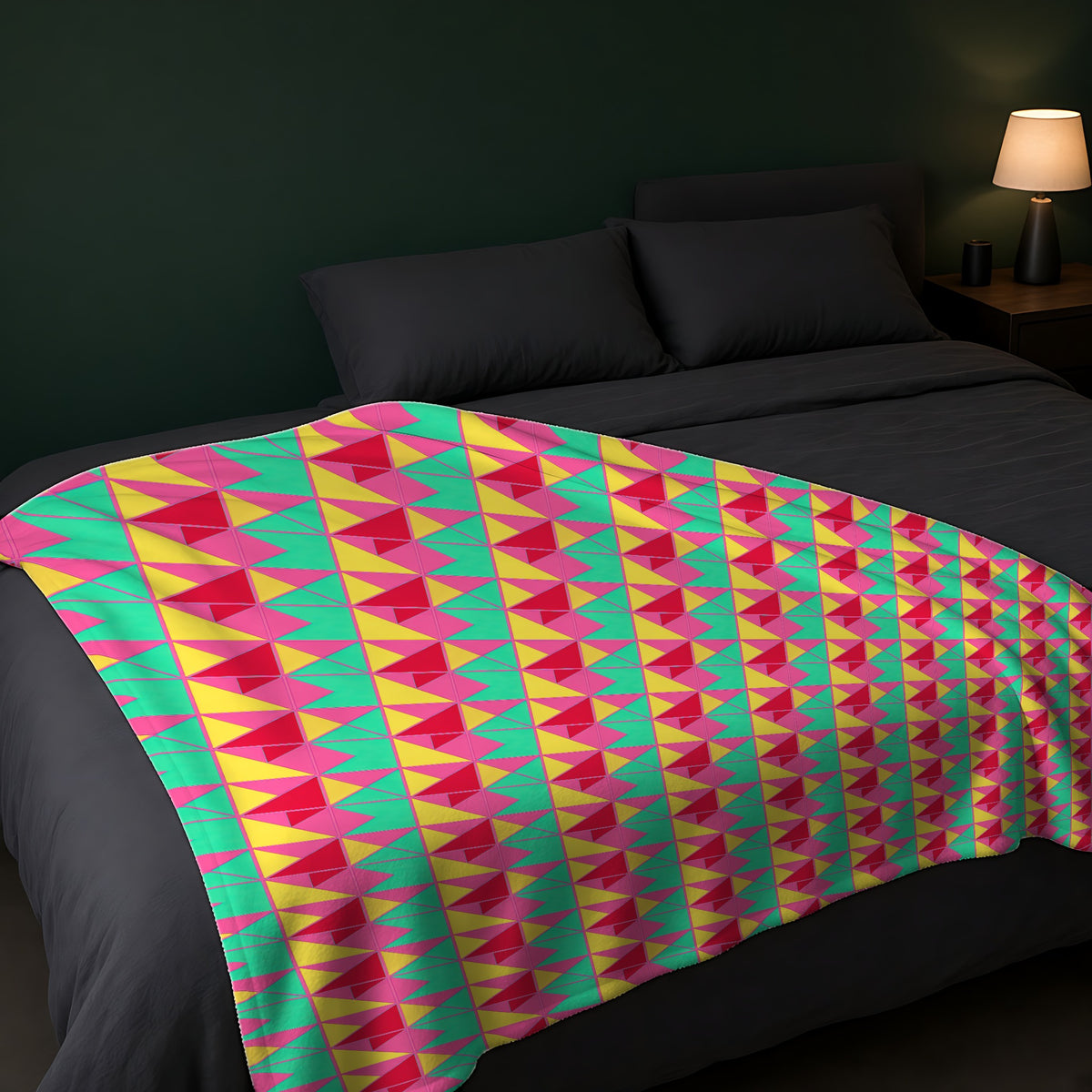 Jewel Block Quilt Sherpa Fleece Blanket across the foot of a dark bed