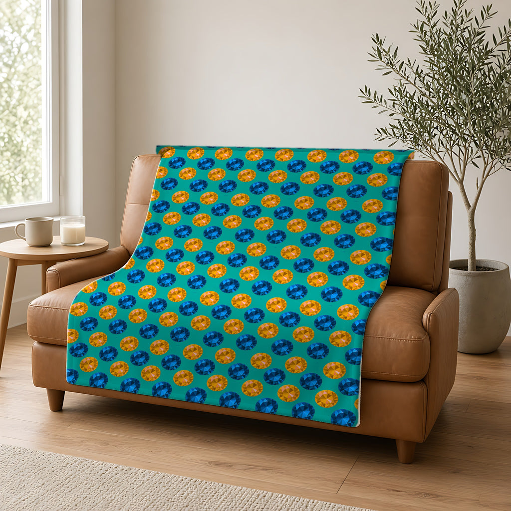 Half-Drop Gem Grid Sherpa Fleece Blanket draped over a caramel leather sofa
