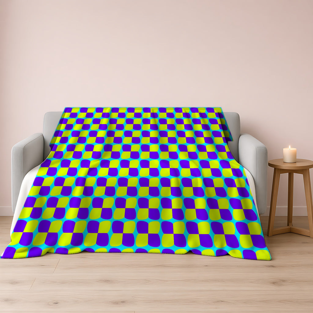 Bold Bulge Checker Sherpa Fleece Blanket draped over a grey sofa