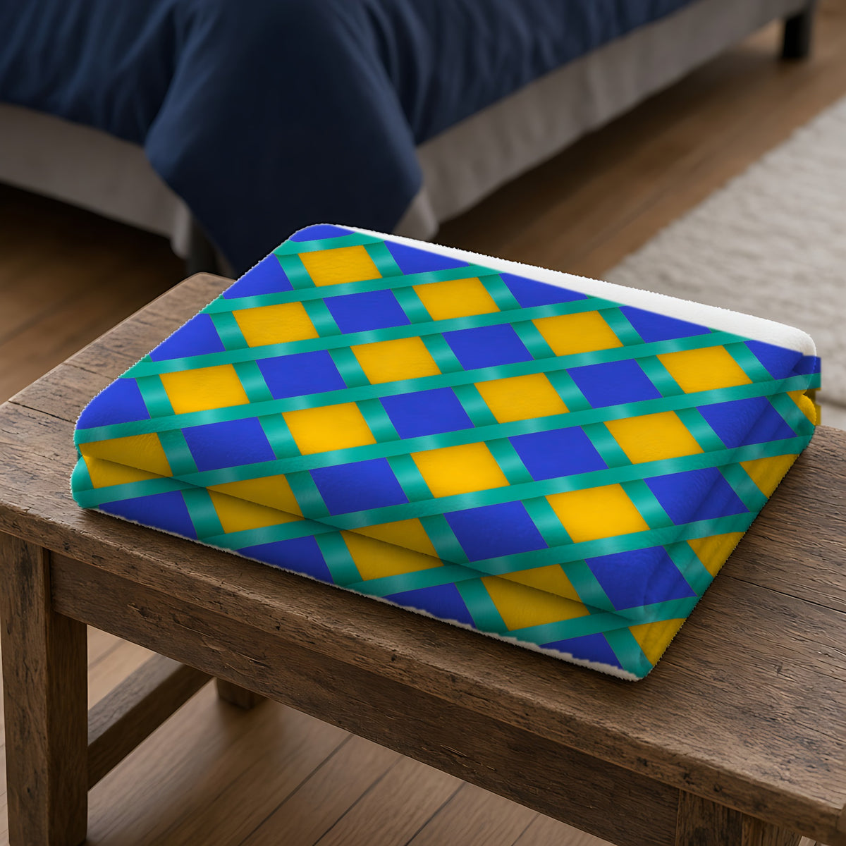 Broad Gold Diamond Trellis Sherpa Fleece Blanket folded on a wooden bench