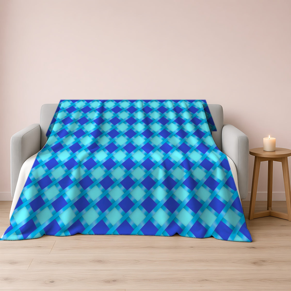 Broad Diamond Trellis Sherpa Fleece Blanket draped over a grey sofa