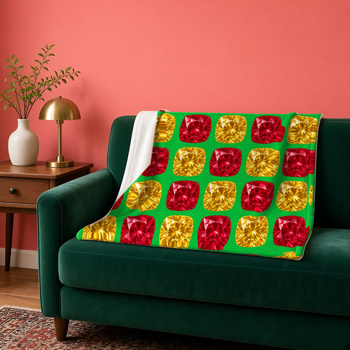 Giant Cut Gem Grid sherpa fleece blanket in the Festive Jewel Bright palette, draped over a green sofa against a coral wall