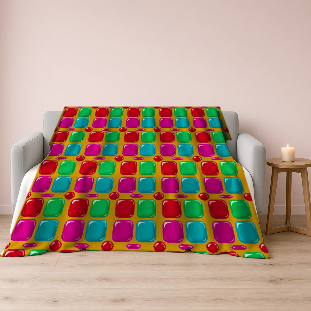Giant Puffy Glass Cushions Sherpa Fleece Blanket draped over a grey sofa