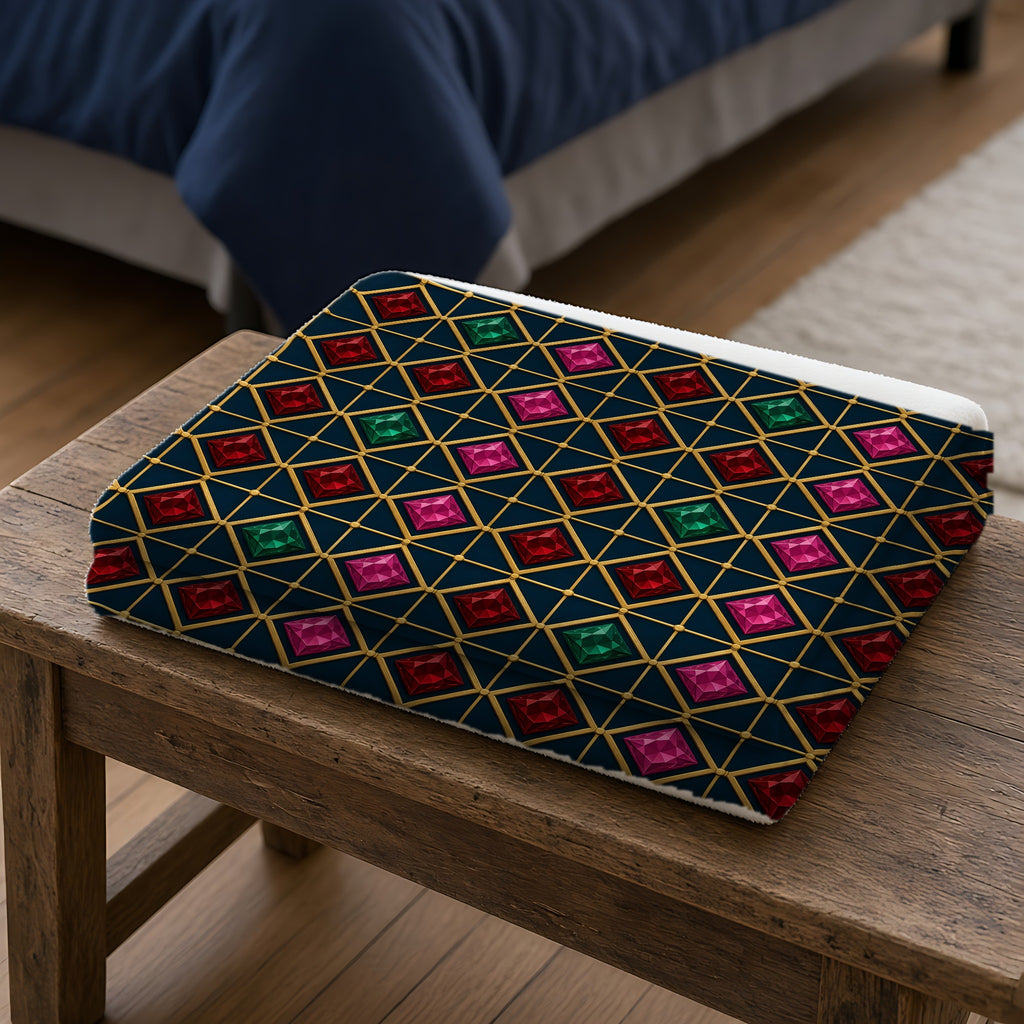Gold Diamond Trellis Sherpa Fleece Blanket folded on a wooden bench