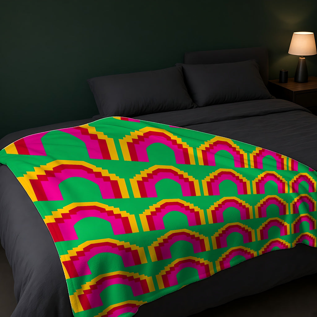Grand Stepped Arches Sherpa Fleece Blanket across the foot of a dark bed
