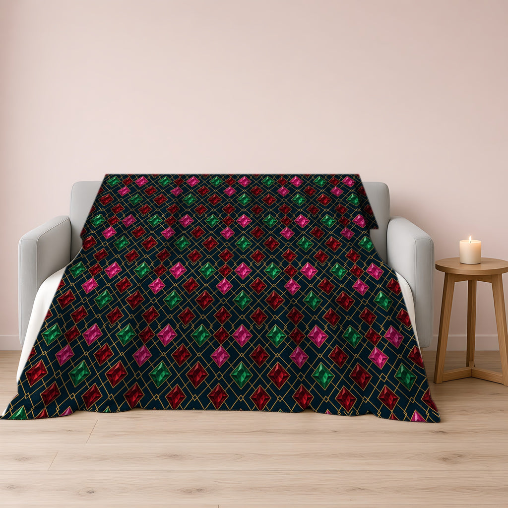 Jewel Argyle Sherpa Fleece Blanket draped over a grey sofa
