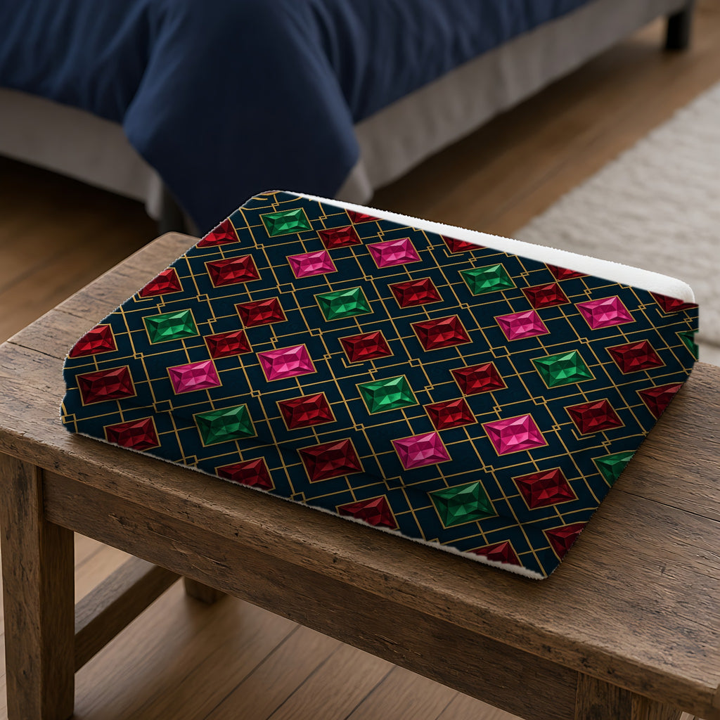 Jewel Argyle Sherpa Fleece Blanket folded on a wooden bench