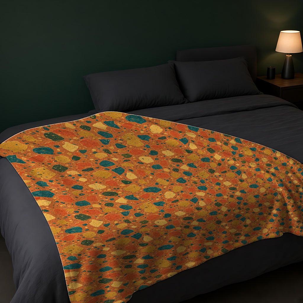 Macro Chip Mix Sherpa Fleece Blanket across the foot of a dark bed