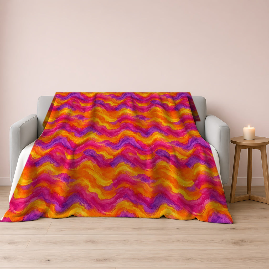 Ombre Wash Bands Sherpa Fleece Blanket draped over a grey sofa