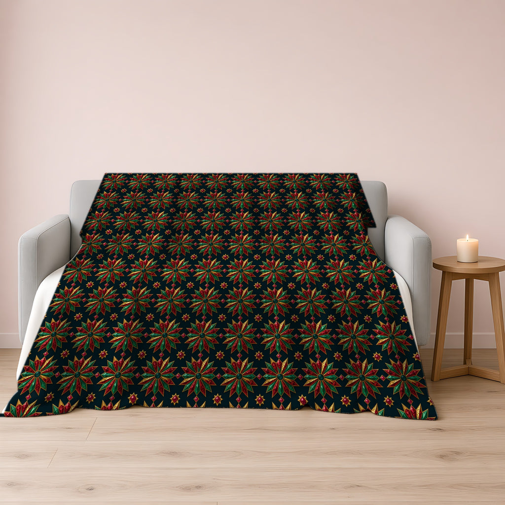 Starburst Medallions Sherpa Fleece Blanket draped over a grey sofa