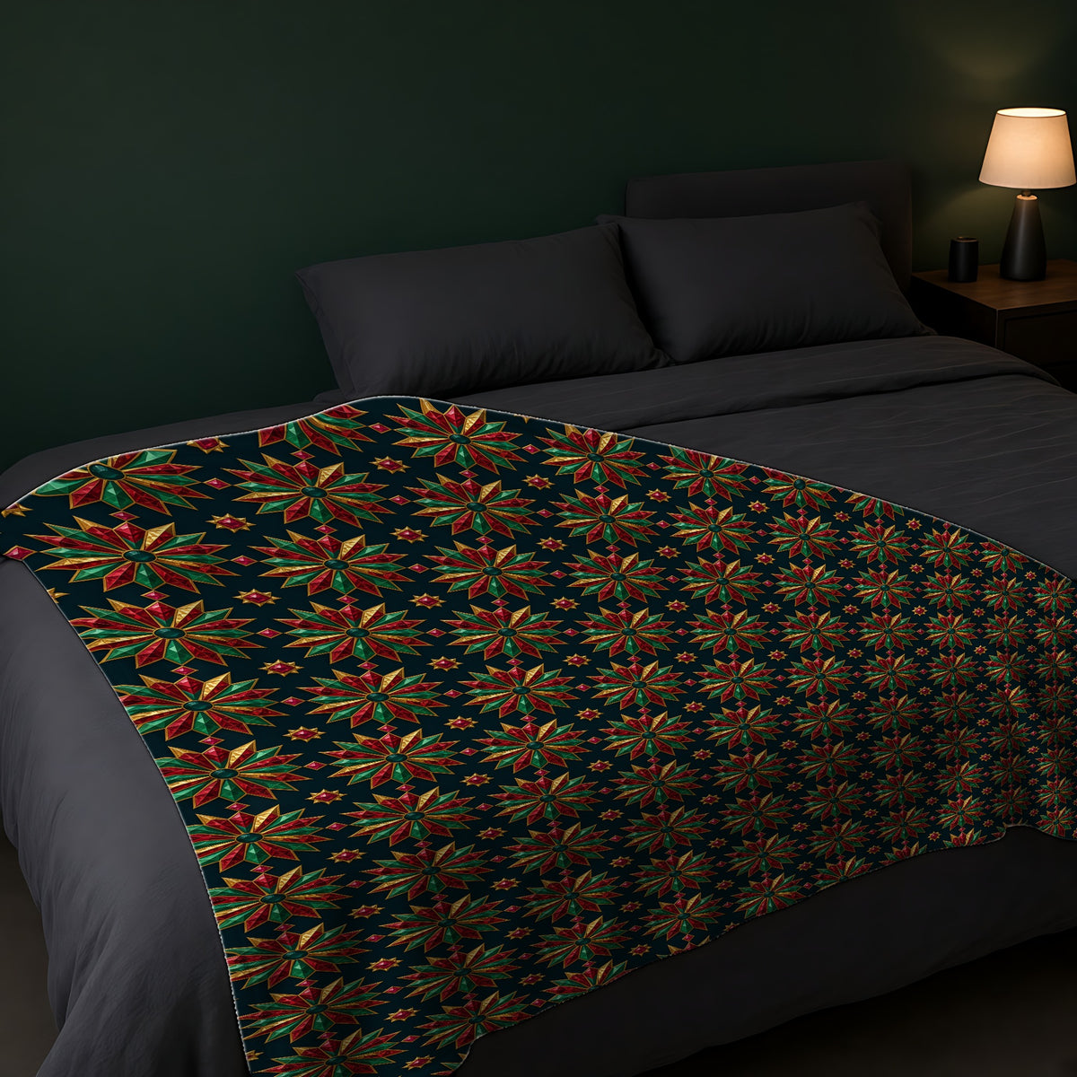 Starburst Medallions Sherpa Fleece Blanket across the foot of a dark bed