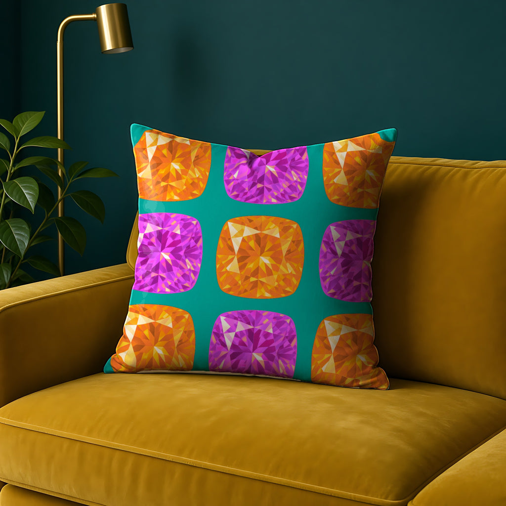 Giant Cut Gem Grid Faux Suede Cushion in the Peacock Jewel palette, on a mustard sofa against a teal wall
